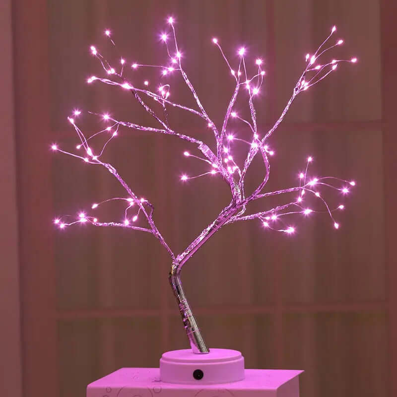 Elegant pink lit tree branch design for enchanting home decor from the Fairytale Trees Collection.