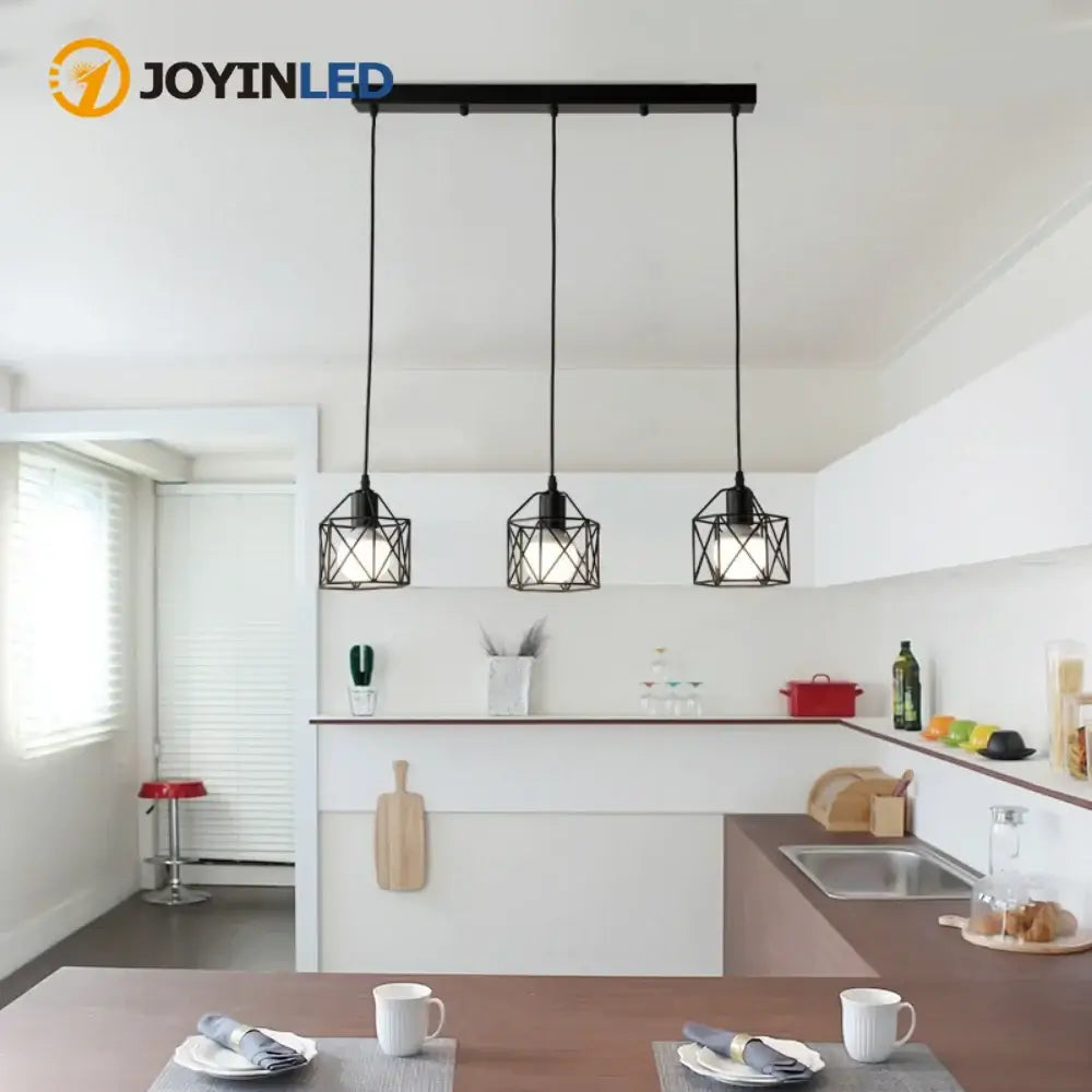 Modern black three-head pendant light fixture in a stylish kitchen by JOYINLED, perfect for dining and bar areas.